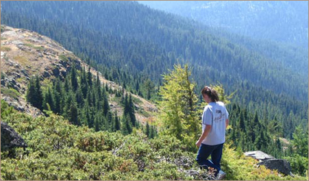 Vicki Bleile standing on Clifty Mountain.